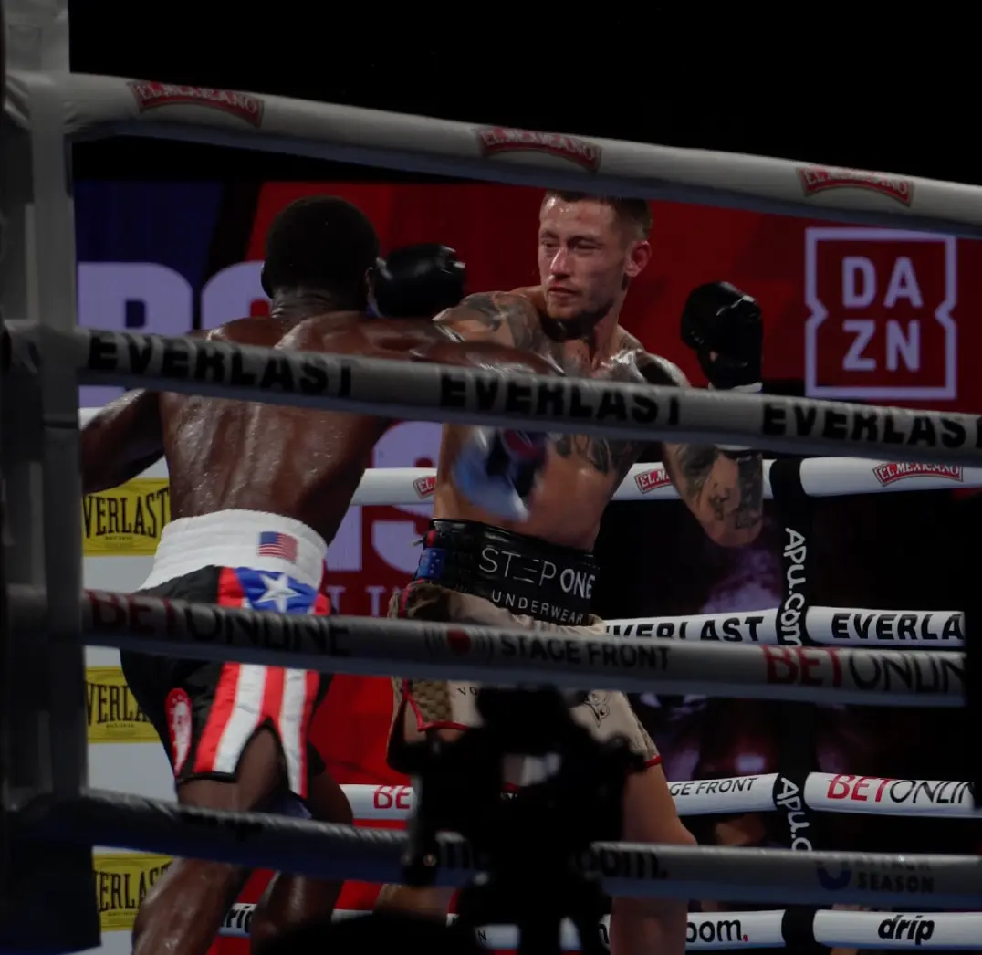 Two boxers exchanging punches during a televised bout