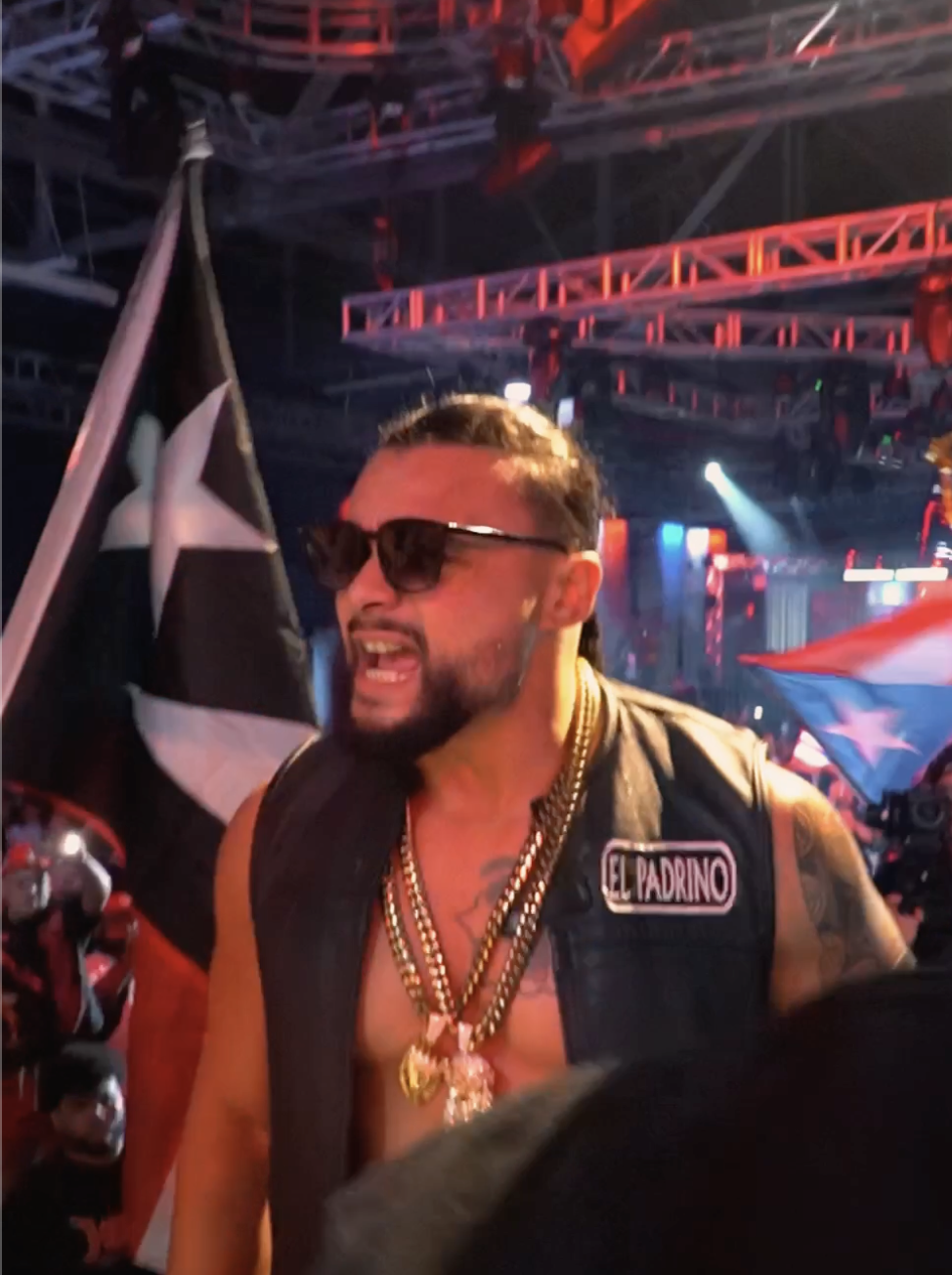 Wrestler in an El Padrino vest entering the arena